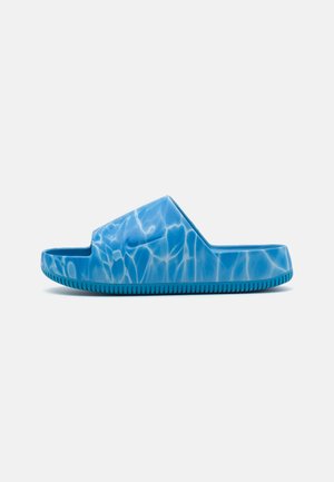 Blue rubber slide sandal featuring a wave pattern. Open-toe design with a thick sole and textured bottom for grip.