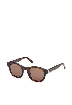 Lunettes de soleil rectangulaires écaille avec des verres marron et des branches fines, marque « GANT » dans le coin droit du verre.