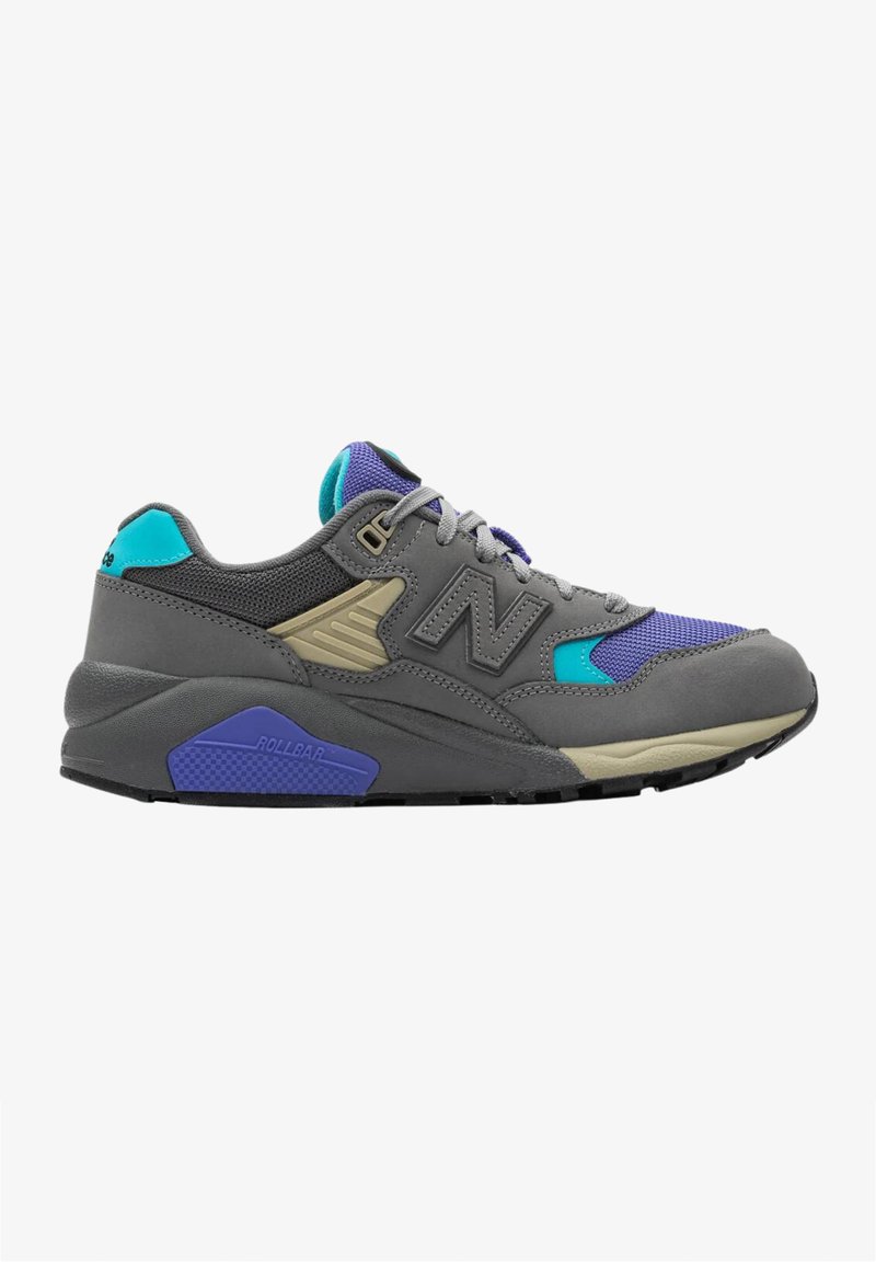 Baskets de sport grises et violettes avec des accents en teal et beige, lacets gris et semelle épaisse marquée "ROLLBAR" sur un fond blanc.