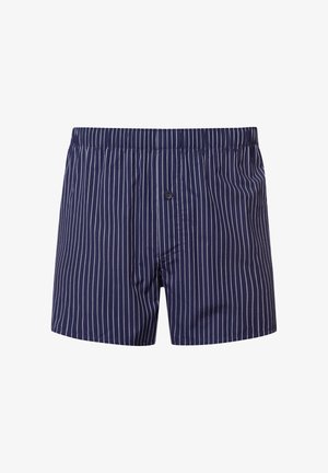 Boxer da uomo a righe navy con elasticità in vita, chiusura a bottoni e righe verticali bianche. Tessuto morbido con una texture liscia.