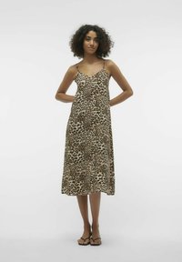 Vestido midi de estampado de leopardo hecho de tejido ligero, con tirantes delgados y una silueta relajada. Acentuado con un diseño fluido.