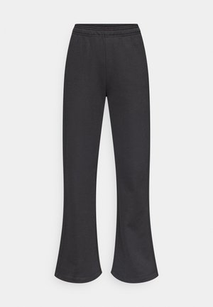 Μαύρες, φαρδιές φόρμες με ελαστική μέση. Κατασκευασμένες από μαλακό, ελαστικό ύφασμα, με απλό σχέδιο χωρίς πρόσθετα μοτίβα.