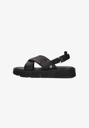 Zwarte leren sandalen met een kruislings ontwerp, verstelbare enkelband en een gestructureerde rubberen zool met een lichte plateau. Gouden logo detail.