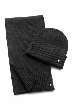 Black knit scarf and beanie set, featuring ribbed texture, compact design, and small metal logo accents. Material appears soft and warm.