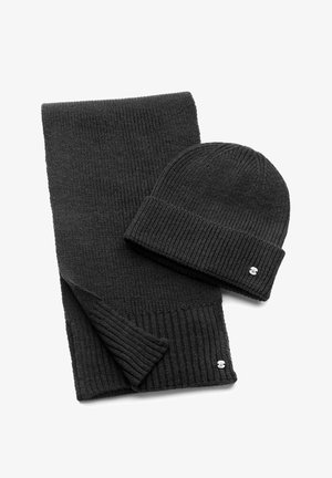 Black knit scarf and beanie set, featuring ribbed texture, compact design, and small metal logo accents. Material appears soft and warm.