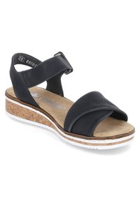Black sandal featuring a cork base, cross-over straps, adjustable ankle strap, and a white rubber sole. Textured insole for comfort.