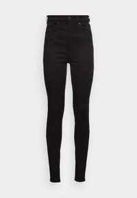 Jeans skinny pretos feitos de denim. Apresentam uma cintura alta, cinco bolsos e fecho de zip com botão. Textura suave e design elegante.