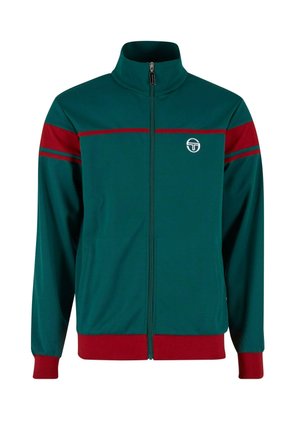 Veste zippée verte avec un col montant, présentant des rayures rouges sur les épaules et l'ourlet inférieur, ainsi qu'un logo circulaire sur la poitrine.