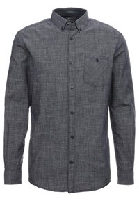 Donkergrijze langek shirt met knopen, een textuurpatroon, een kraag en een borstzak met een knoopdetail.