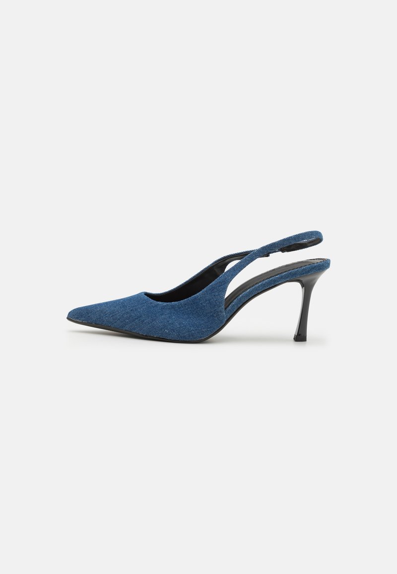 Blue denim slingback heels with a pointed toe, featuring a slender black heel and a textured fabric upper. Open back design.