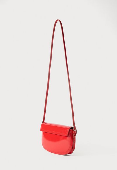 Red leather crossbody bag with a smooth, glossy finish. Features a rounded shape, a fold-over flap, and an adjustable shoulder strap.