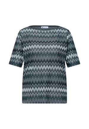 Top en maille manches courtes à motif zigzag noir, blanc et gris, avec col rond et coupe régulière.