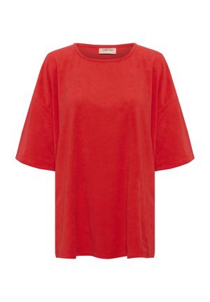 Czerwona, krótkie rękawy koszula z miękkiego, aksamitnego materiału. Posiada okrągły dekolt i luźny krój o gładkiej teksturze.