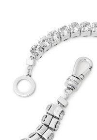 Silver bracelet featuring rectangular links and round crystal accents, secured with a clasp and a circular ring detail.