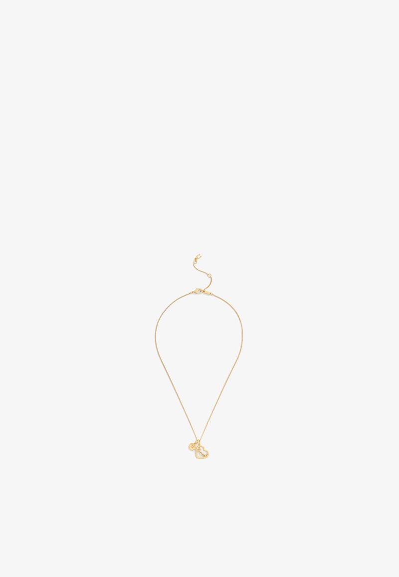 Gold-tone necklace featuring a slender chain with a small heart-shaped pendant and a clasp closure. Simple and minimalistic design.