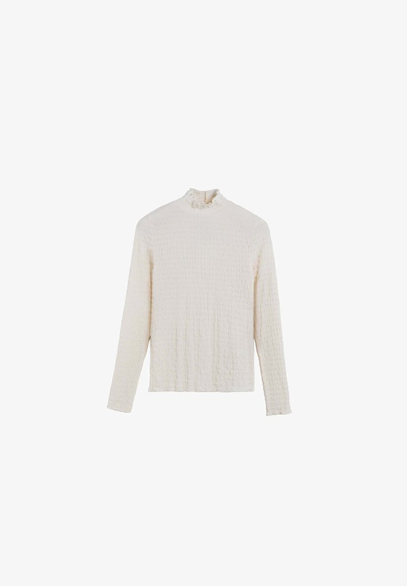 Cream-colored long-sleeve top with a textured, crinkled fabric, featuring a ruffled mock neckline and a relaxed fit.