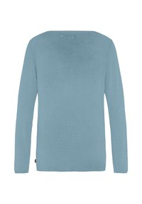 Lichtblauw langetermijn shirt gemaakt van zachte, lichte stof. Heeft een ontspannen pasvorm en een ronde halslijn zonder extra accenten.