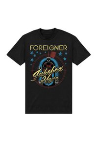 Czarna koszulka z grafiką vintage jukeboxa i napisem "Foreigner Jukebox Hero", ozdobiona gwiazdkami w kolorze niebieskim i żółtym.