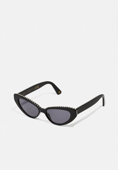 Black cat-eye sunglasses with dark tinted lenses and a crystal accent along the upper edge of the frame. Smooth plastic finish.