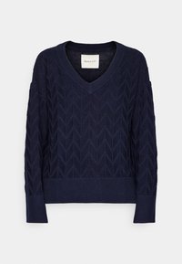 Pull en tricot bleu marine avec col en V, manches longues, motif chevron texturé, et poignets et ourlet côtelés.
