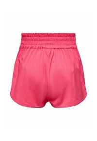 Lyserøde sportsshorts med elastisk talje, lavet af glat stof. Designet har en løs pasform og buede sømkanter.