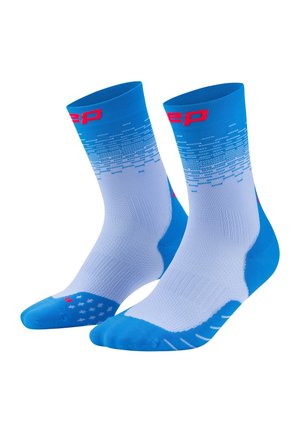 Blue and white athletic crew socks with red logo on top and textured grip pattern on foot area.
