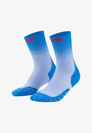 Blue and white athletic crew socks with red logo on top and textured grip pattern on foot area.