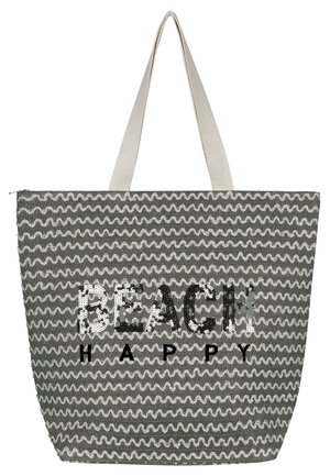 Grau gewebte Tragetasche mit weißem Wellenmuster, mit "BEACH" aus Pailletten und "HAPPY" in Schwarz. Zwei Stoffgriffe. Reißverschluss.