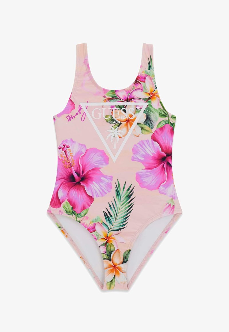 Maillot de bain une pièce rose avec des fleurs tropicales et des feuilles vertes, avec un logo blanc GUESS Beach avec un palmier.