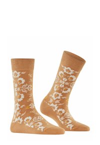 Bursztynowe skarpetki z białymi kwiatowymi wzorami, prążkowanymi mankietami i miękką teksturą, z misternymi wzorami w żółtych i kremowych akcentach.