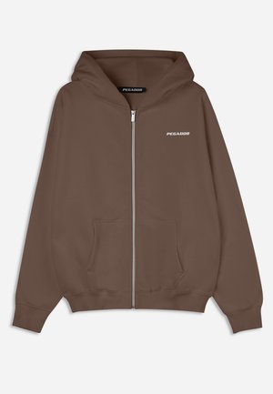 Brown zip-up hoodie with a drawstring hood, front pockets, ribbed cuffs, and a small white "PEGADOR" logo on the chest. Smooth texture.