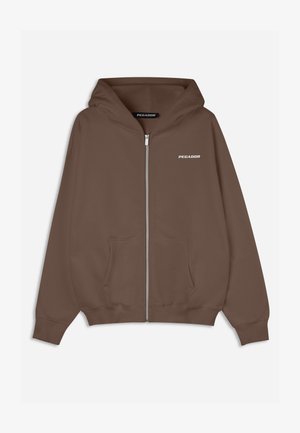 Brown zip-up hoodie with a drawstring hood, front pockets, ribbed cuffs, and a small white "PEGADOR" logo on the chest. Smooth texture.
