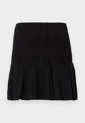 Jupe noire en tissu doux, avec un design texturé et plissé, dotée d'un ourlet en zigzag. Longueur mi-cuisse avec une taille ajustée.