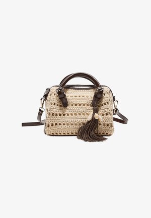 Handwoven beige handbag with dark brown leather handles, detachable shoulder strap, and decorative dark brown tassel with shell charms.