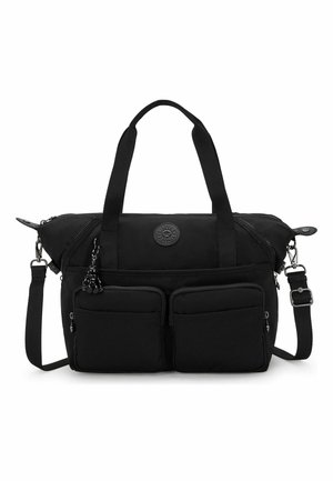 Black nylon tote bag with double handles, adjustable shoulder strap, front zipper pockets, and a small keychain charm attached.