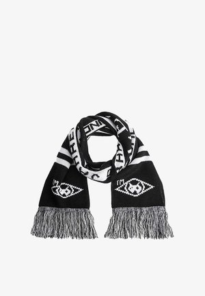 Knit black and white scarf featuring geometric pattern, fringe edges, and text. Material is soft and flexible, suitable for casual wear.
