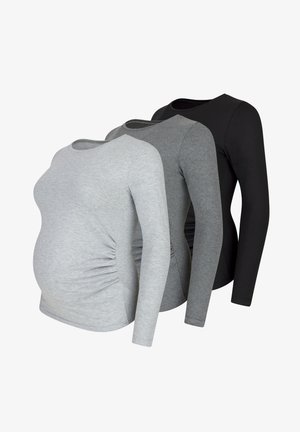 Chemises de maternité à manches longues en gris clair, gris foncé et noir. Présentent des détails froncés sur les côtés et un tissu doux et extensible.