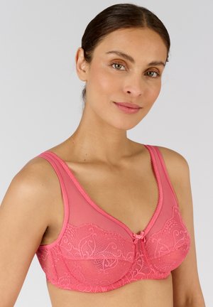 Roze kanten beha met een gladde onderlaag, brede banden en een centrale strikaccent. Intricate bloemmotieven sieren de cups.