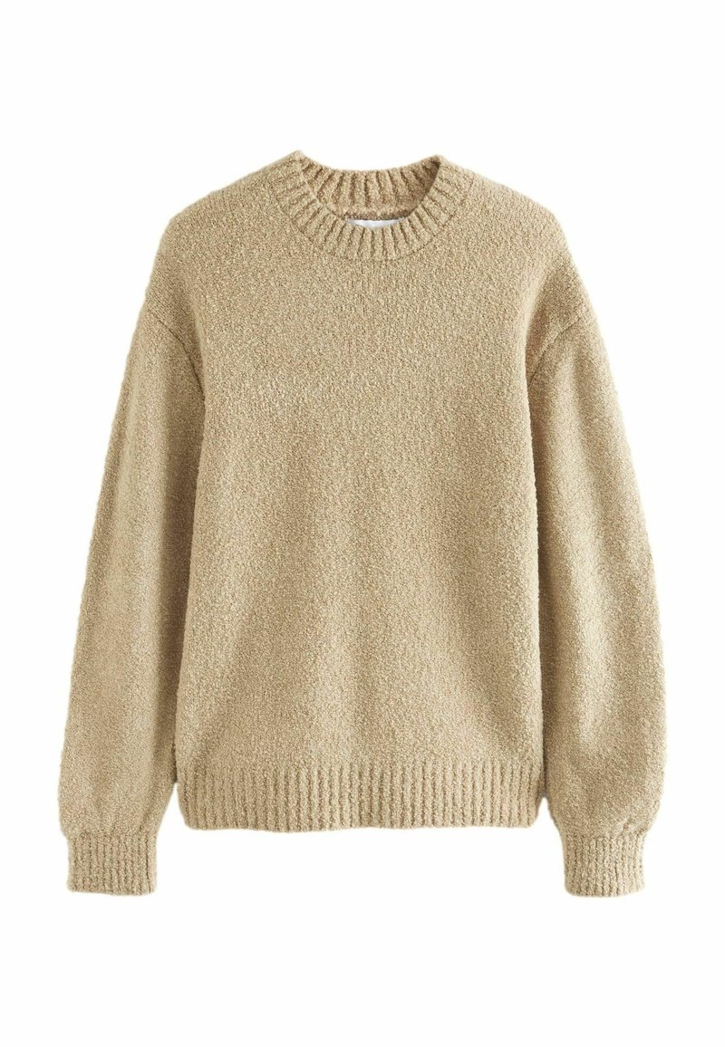 Beige gebreide trui met een gestructureerd, pluizig oppervlak, geribbelde halslijn, manchetten en zoom. Relaxte pasvorm met verlaagde schouders.