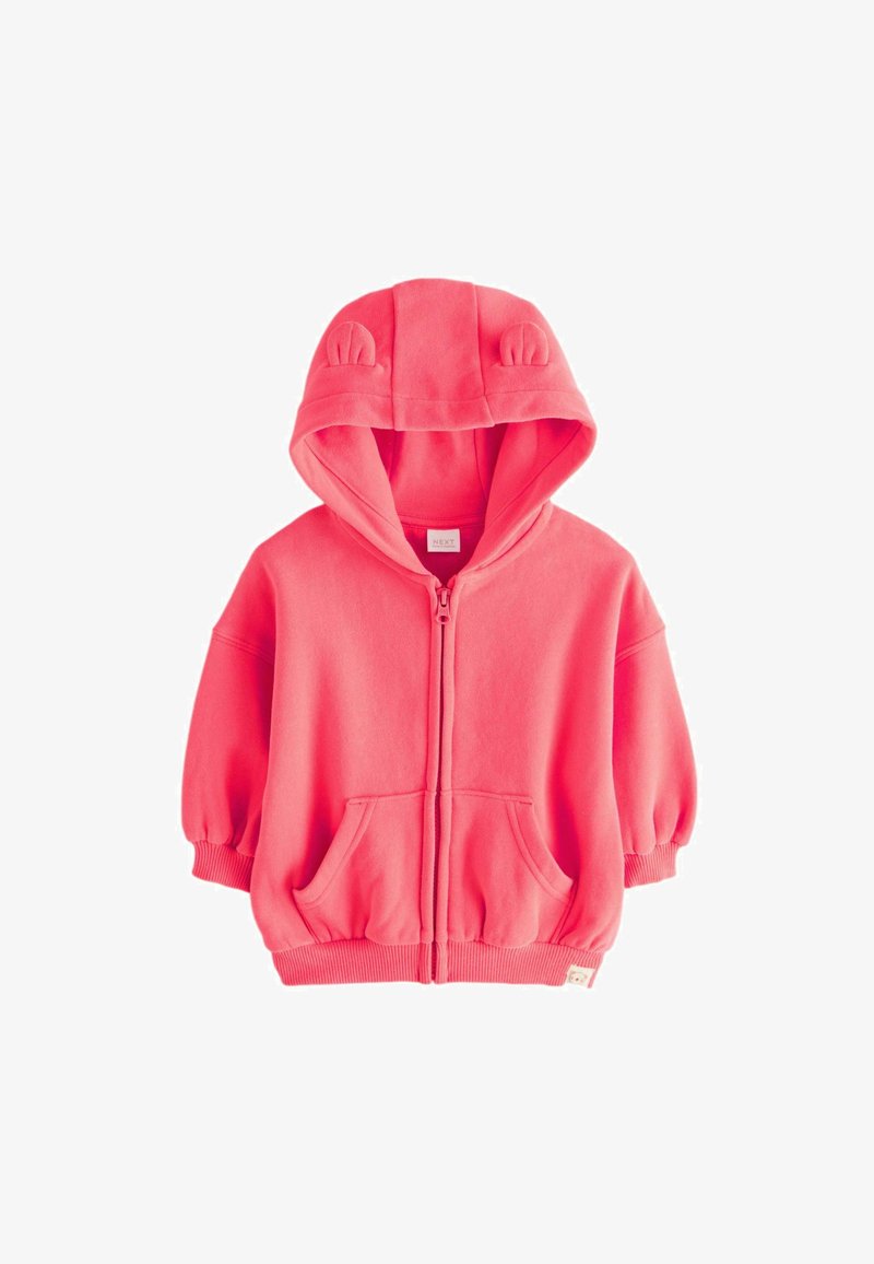 Felpa rosa con zip, dotata di dettagli con orecchie di coniglio sul cappuccio, tasche frontali e polsini elasticizzati. Realizzata in morbido tessuto testurizzato.