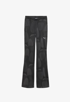 Mustad musternikuga mustad spordipüksid, flared jala kujundusega. Valmistatud siledast kangast. Valge Puma logo.