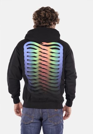 Felpa nera con cappuccio caratterizzata da una vivace grafica della gabbia toracica a ombre rainbow sul retro. Tessuto morbido con una vestibilità rilassata.