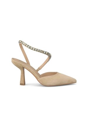 Nude suede high-heeled slingback shoe with a pointed toe and embellished strap featuring clear rhinestones and a sturdy block heel.