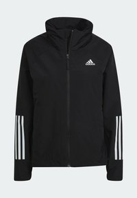 Giacca atletica nera con colletto alto, zip frontale e logo Adidas bianco. Presenta tre strisce bianche su ciascun maniche. Materiale leggero.