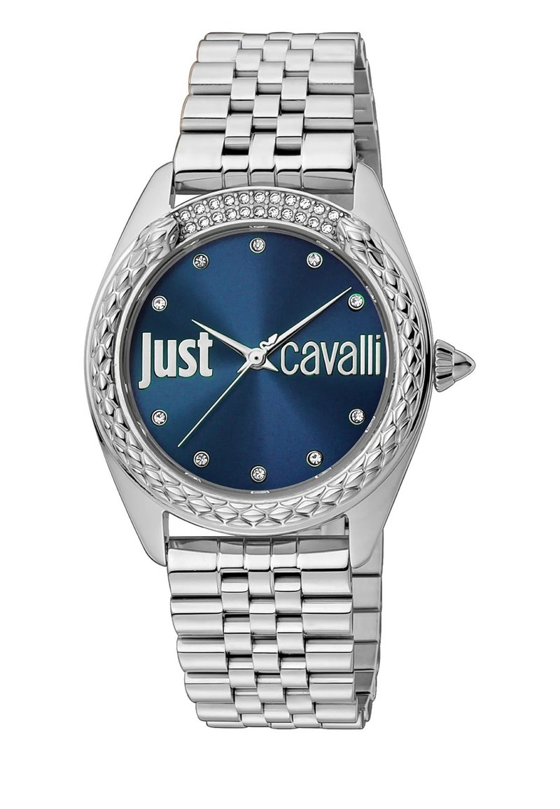 Roostevabast terasest kell hõbedase rihmaga, sinise kellapinnaga ja teemantaktsentidega. Omab tekstuuriga raamistikku ja "Just Cavalli" logo.