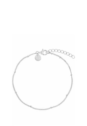 Delicate silver chain bracelet with small bead accents, lobster clasp, extension chain, and a round charm near the clasp.
