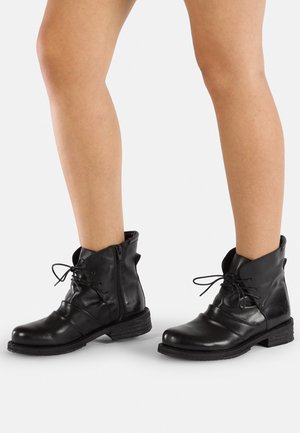 Black leather ankle boots with a rounded toe, lace-up front, and side zipper; textured finish and stacked block heel.