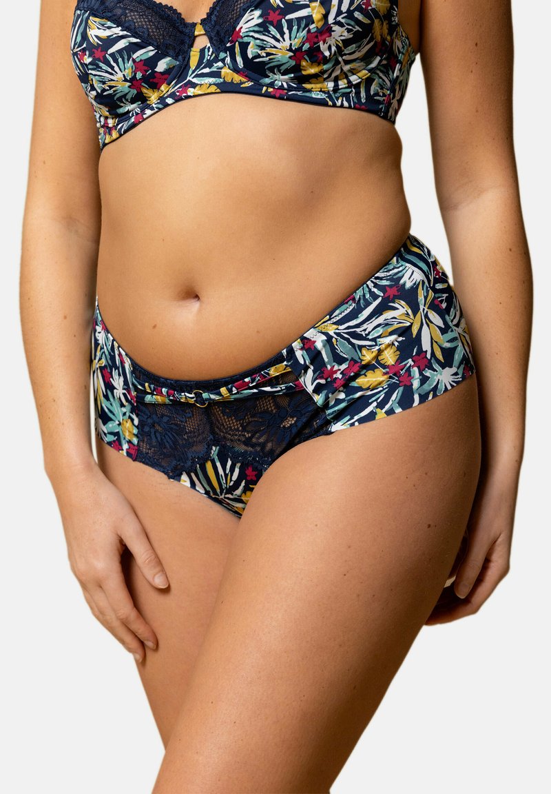 Ensemble de soutien-gorge et culotte assortis en imprimé floral sur fond marine. Présente une bordure en dentelle et un bandeau élastique, avec un mélange de motifs et de textures colorés.