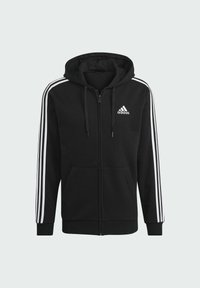 Moleton preto com fecho, feito de fleece, apresentando um fecho na frente, dois bolsos laterais e detalhes brancos de três riscas nas mangas.