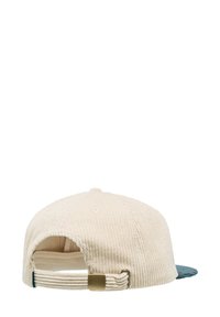 Cappellino da baseball in corduroy crema con visiera turchese. Presenta una texture a costine, cinturino regolabile e hardware in metallo per la chiusura.